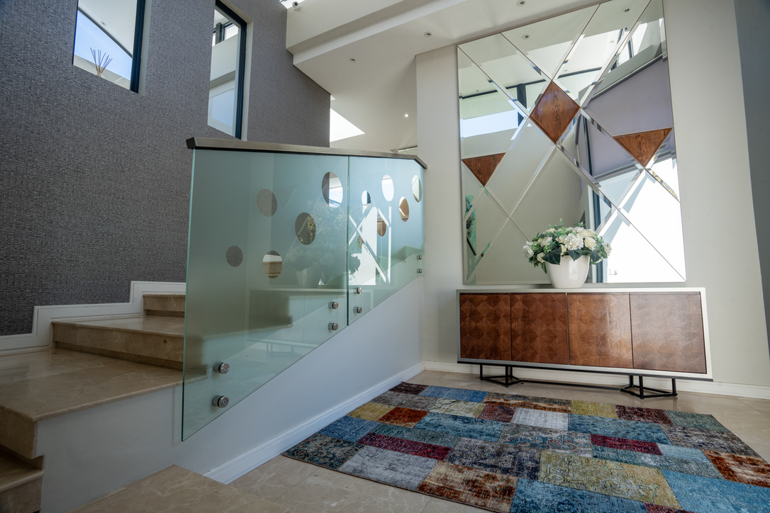 Grand entrance with glass staircase